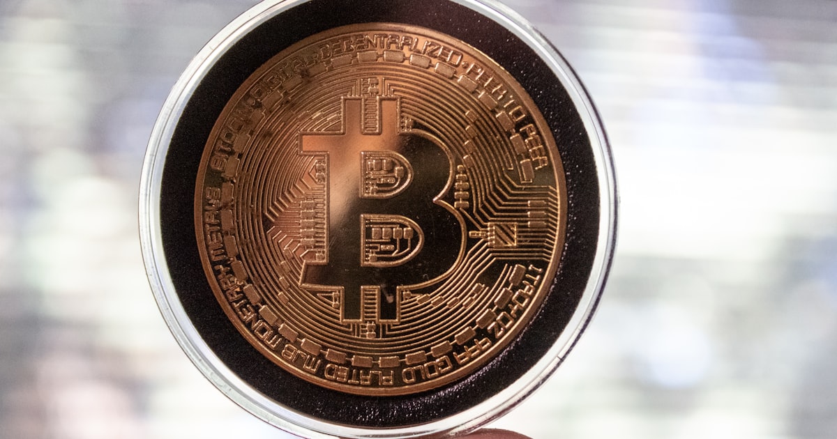 gold and black round coin