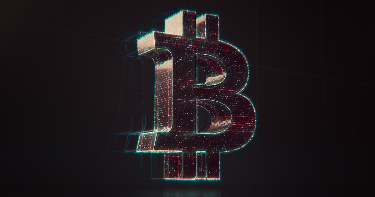 A shiny bitcoin logo on a black background