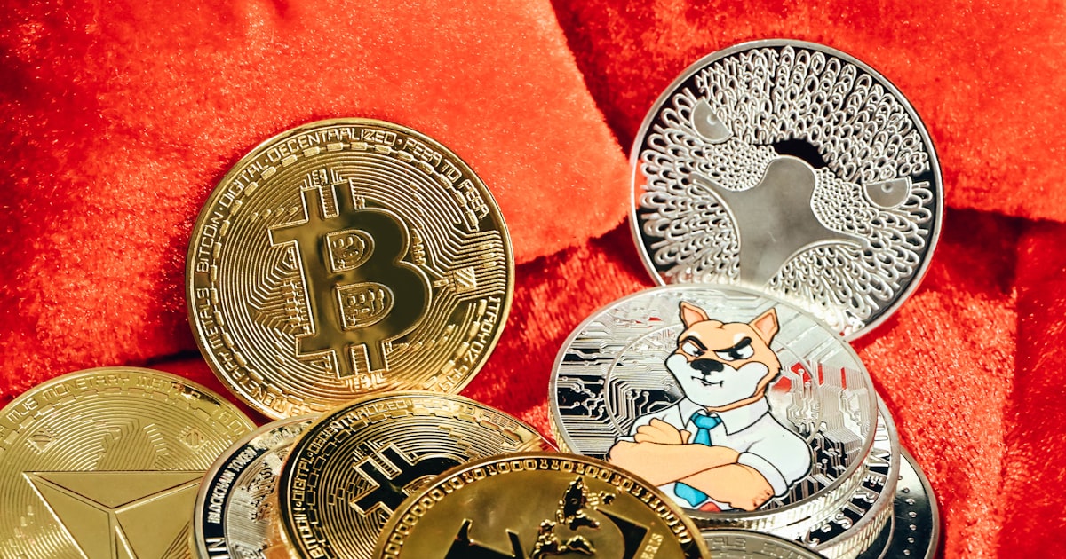 a pile of bitcoins sitting on top of a red blanket