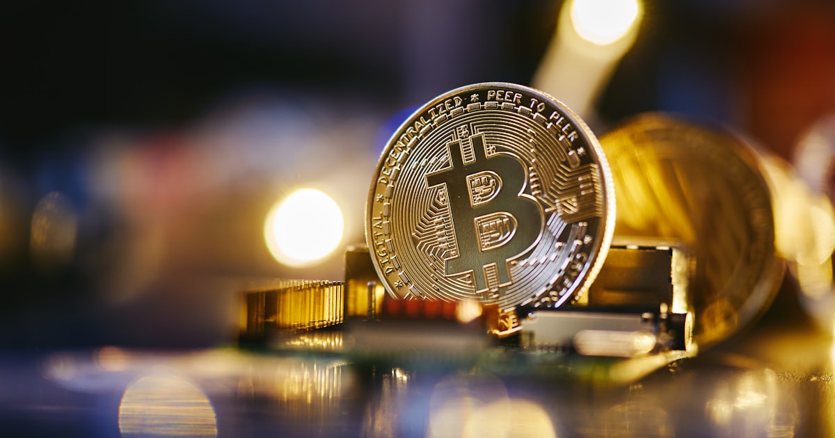 a bitcoin sitting on top of a computer chip