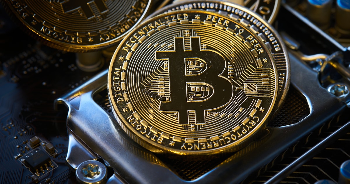 a bitcoin sitting on top of a computer motherboard