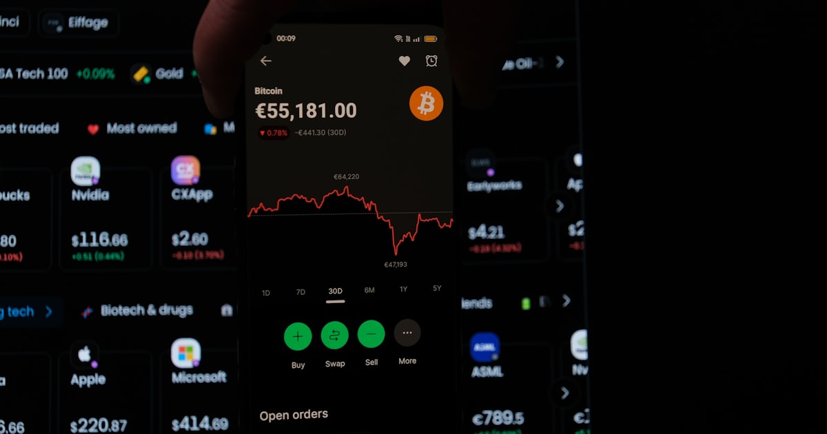 A person holding a cell phone in their hand