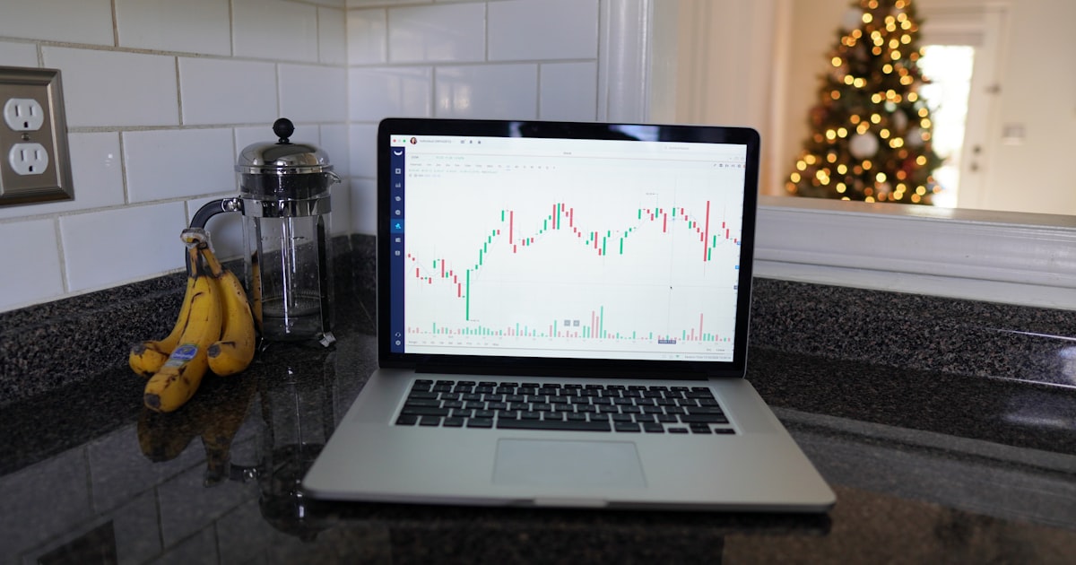 macbook pro on black table