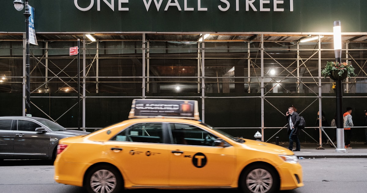 yellow taxi cab in front of the building