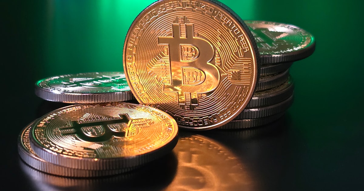 a pile of bitcoins sitting on top of a table