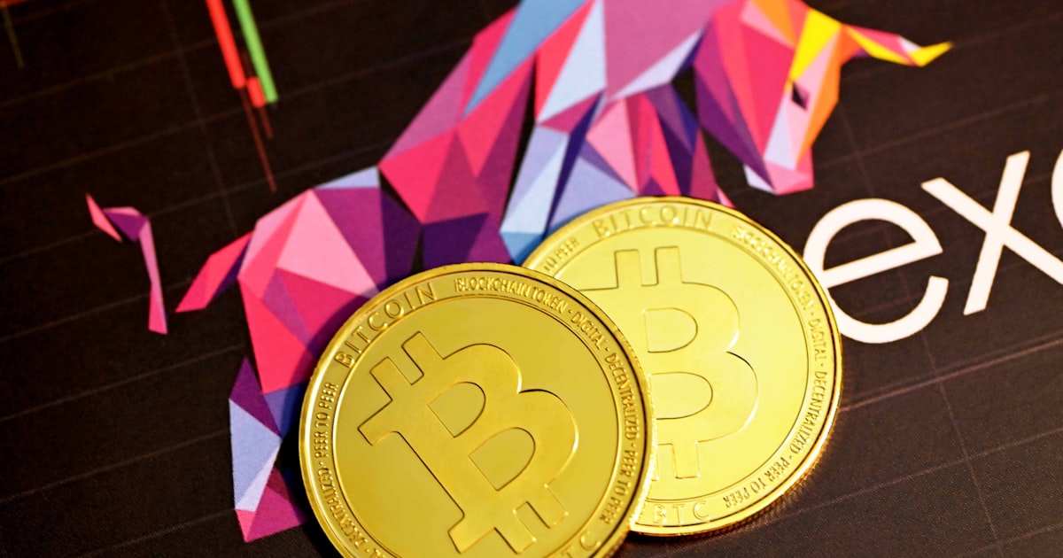 two bitcoins sitting next to each other on a table