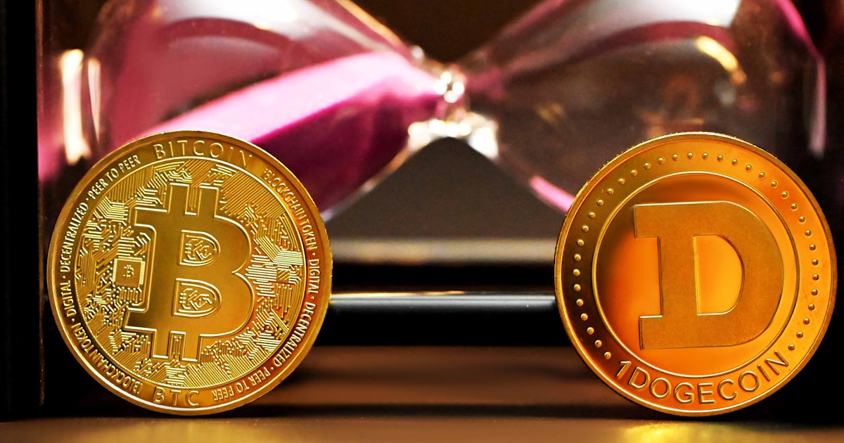 two bitcoins sitting next to each other on a table