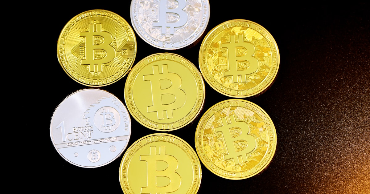 gold round coins on black background