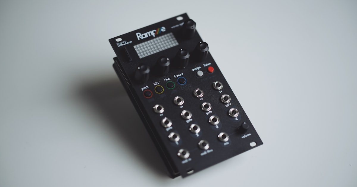 Black electronic music synthesizer with knobs and jacks