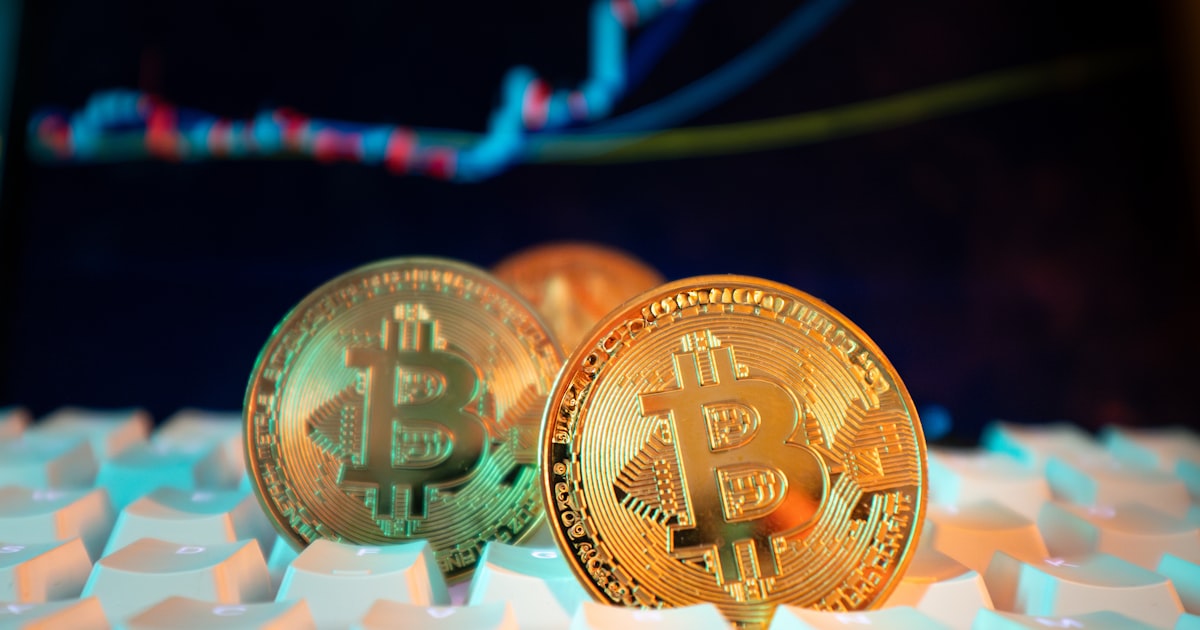 Bitcoin coins are displayed with a stock chart.