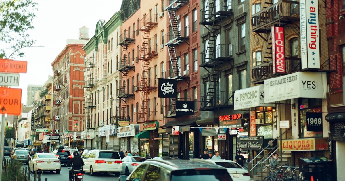 a city street filled with lots of tall buildings