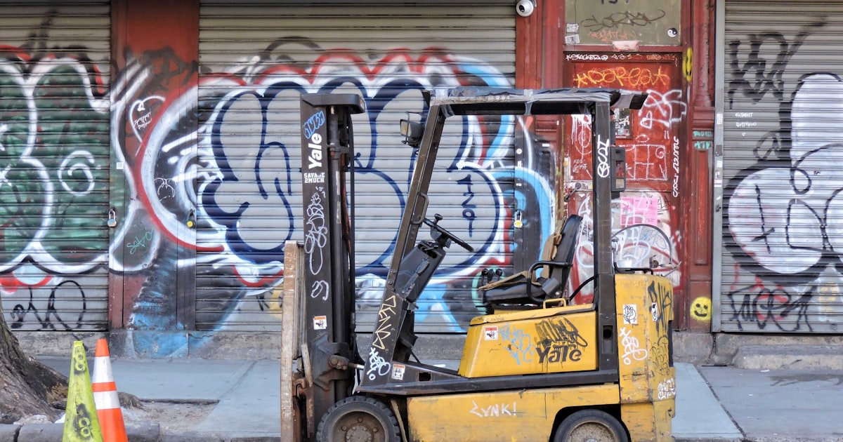 a forklift parked on the side of a street