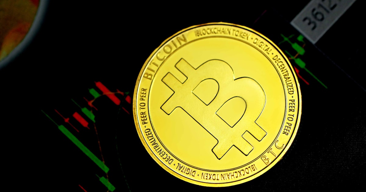 a bit coin sitting on top of a table