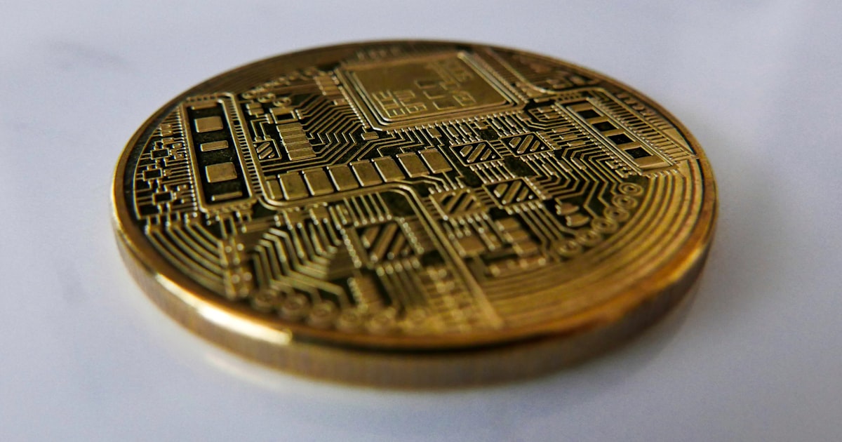a close up of a coin on a white surface