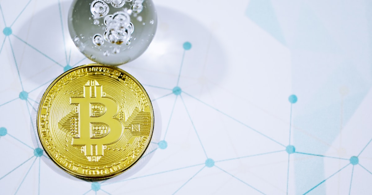 a bitcoin is sitting on top of another coin