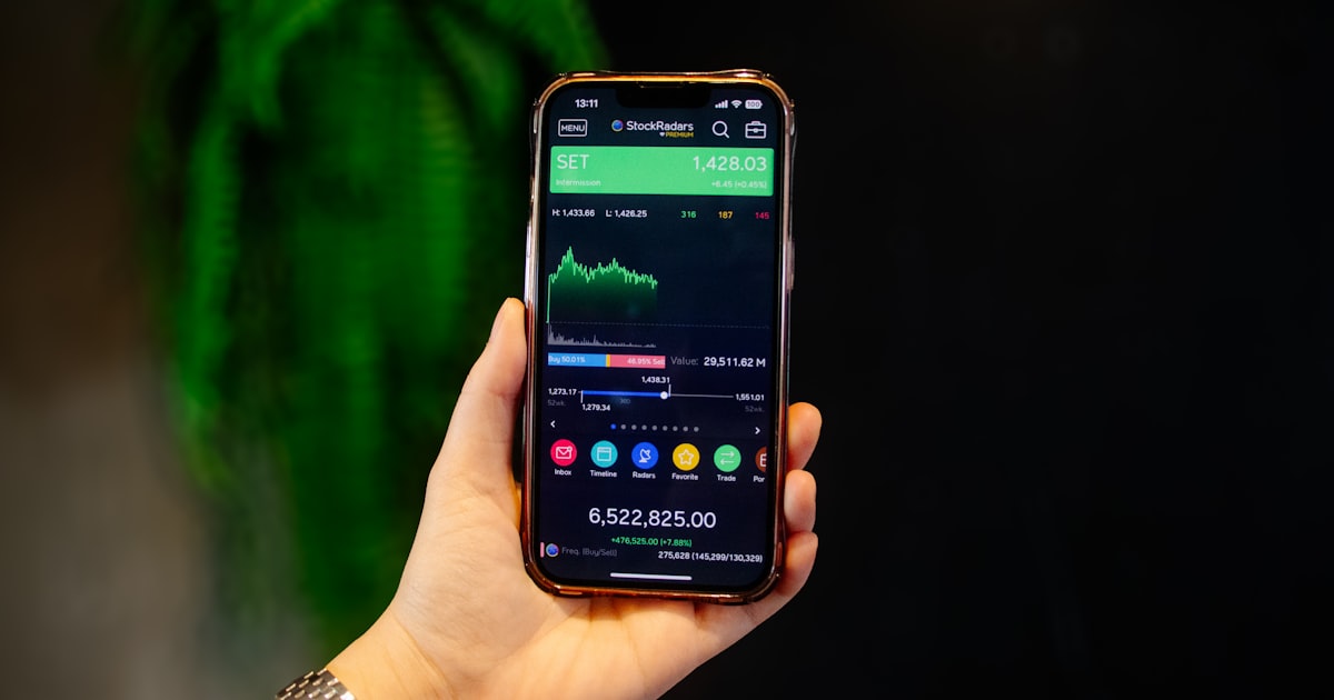 A person holding a smart phone in their hand