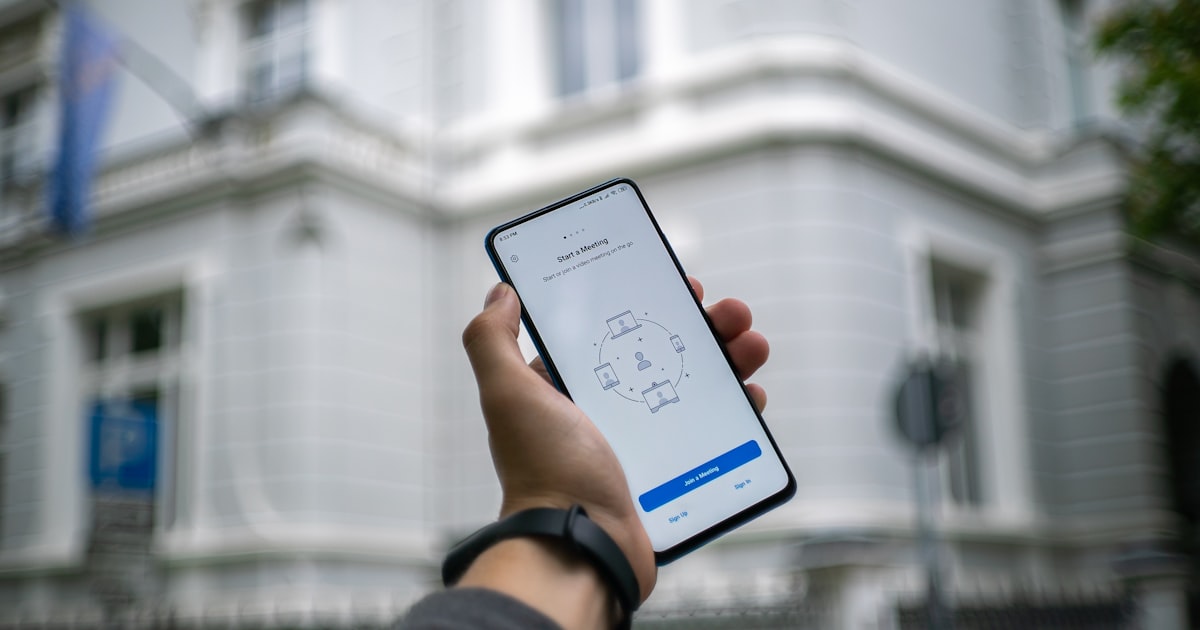 person holding white android smartphone