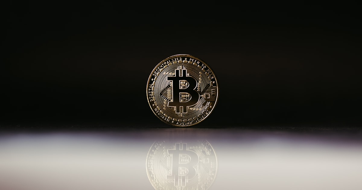 a bit coin sitting on top of a table