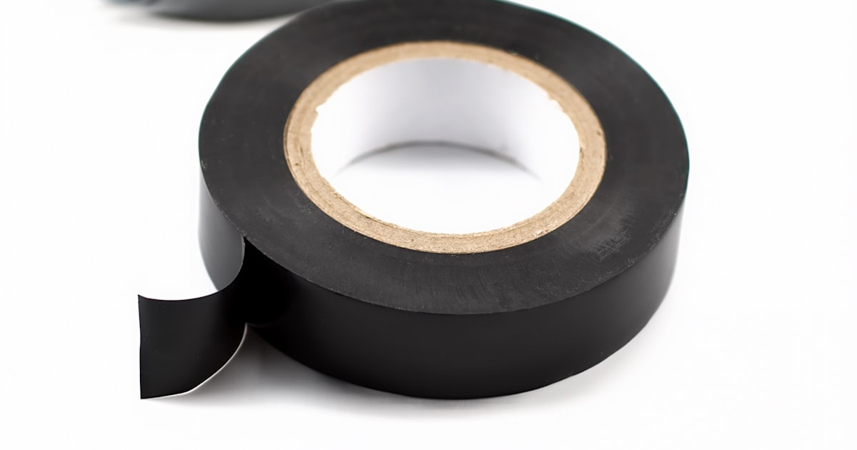 Roll of black electrical tape on white background