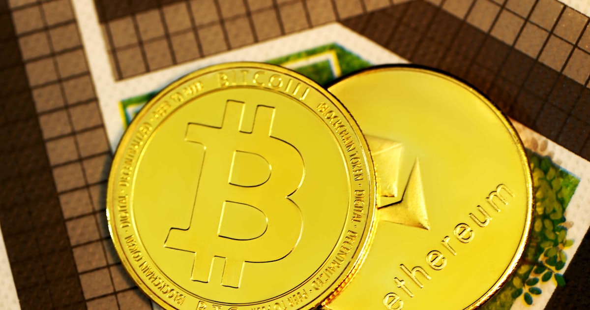 gold round coin on brown and white textile