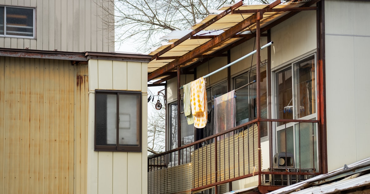 Exterior of old buildings with balconies and washing.
