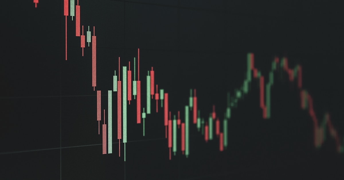 Stock market chart shows a declining trend.