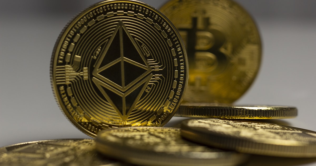 a pile of gold bitcoins sitting on top of a table