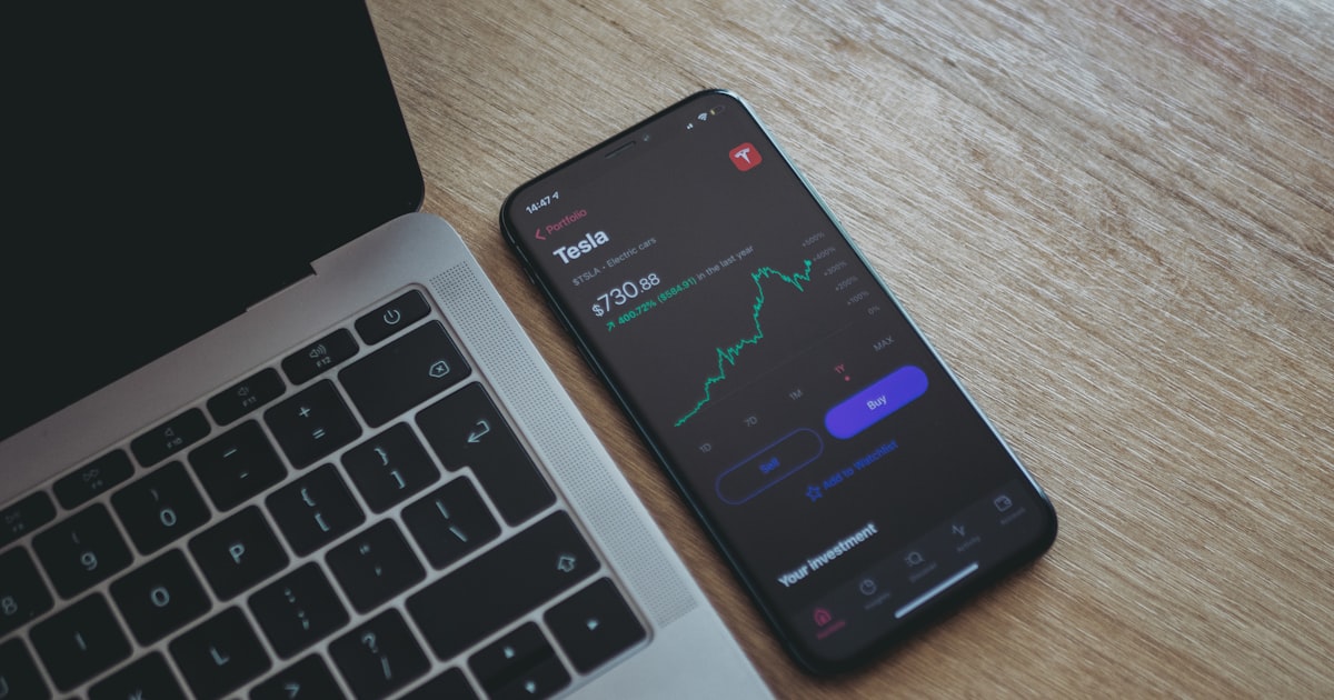 black android smartphone on macbook pro