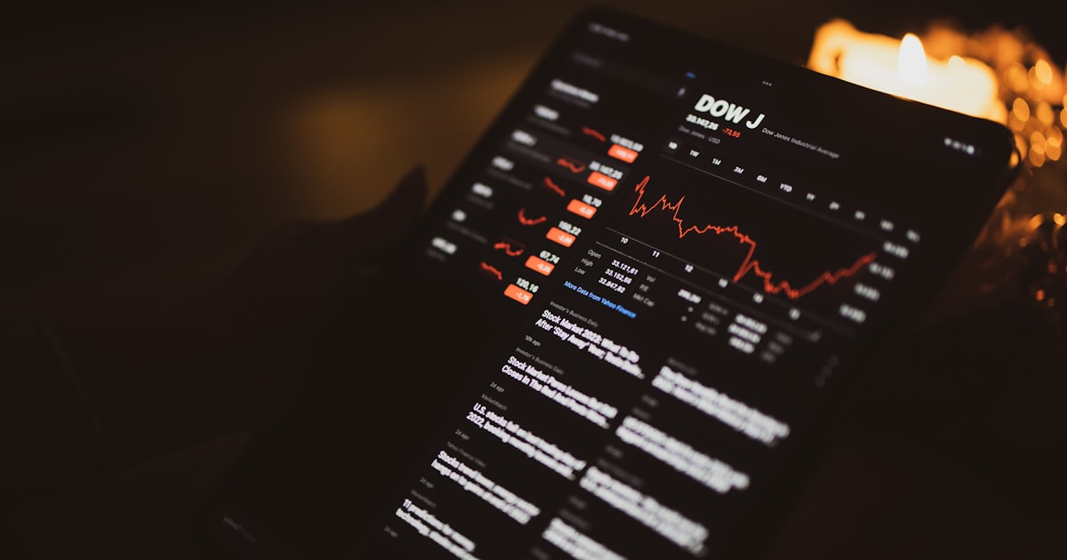 a close up of a computer screen with candles in the background