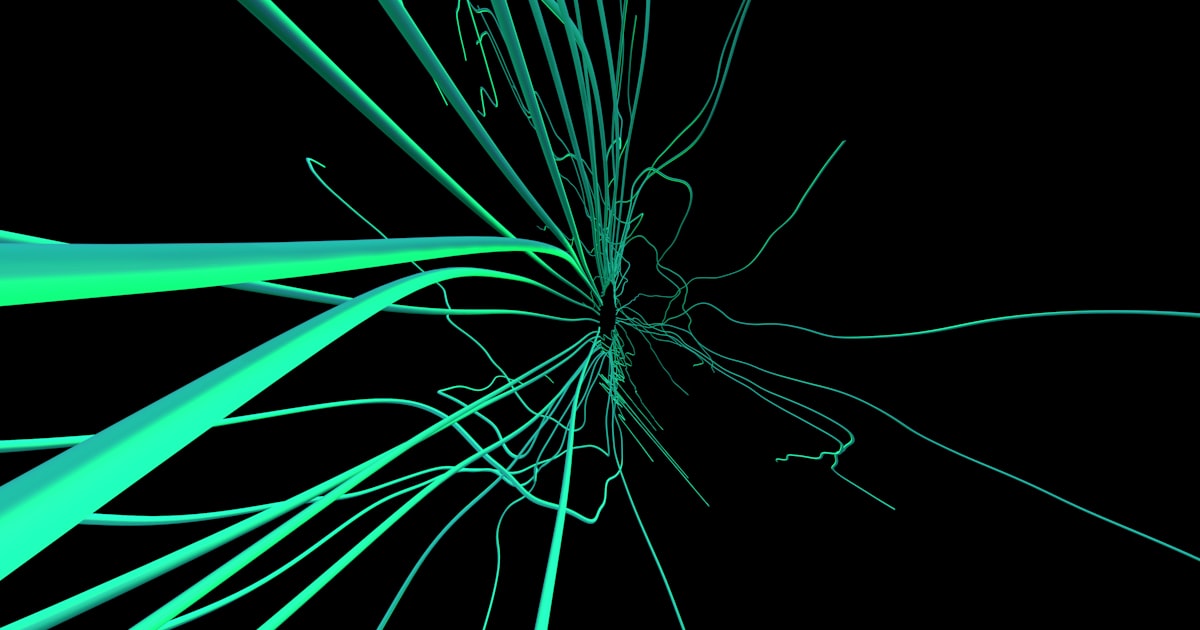 A close up of a green flower on a black background