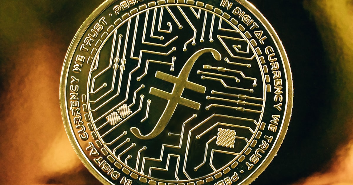 a gold coin with a bitcoin printed on it