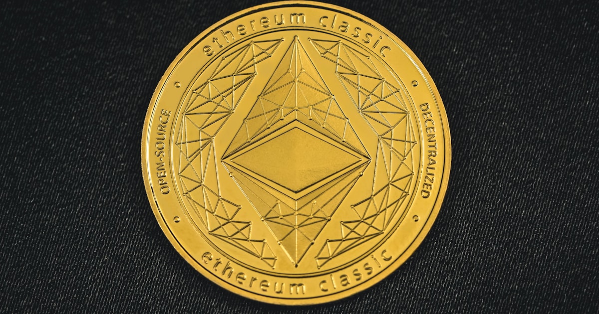 a close up of a coin on a black surface