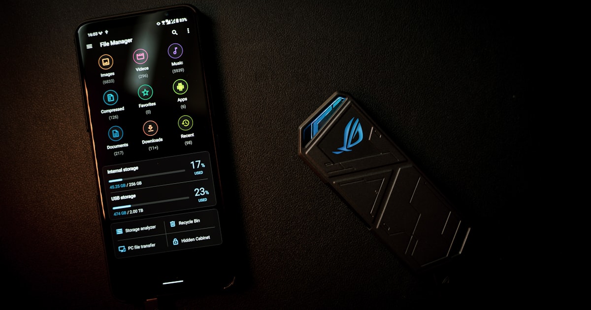 black samsung remote control on black textile