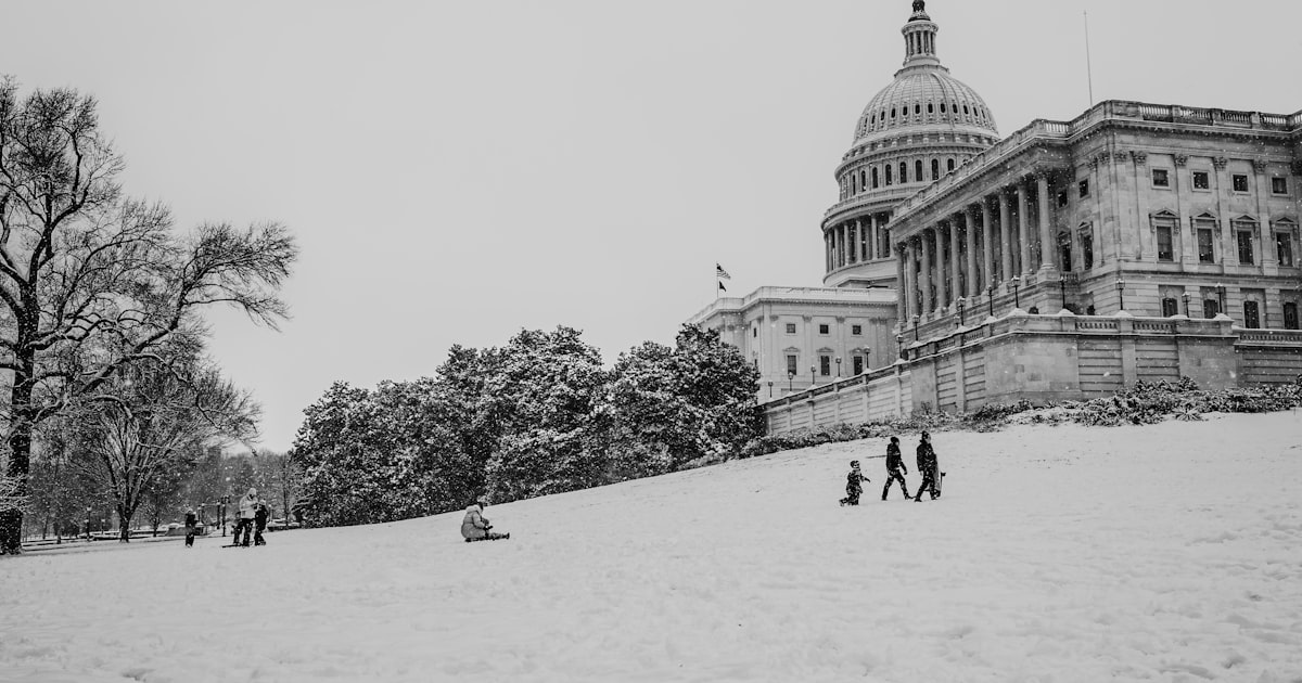 United states capitol building covered in snow
