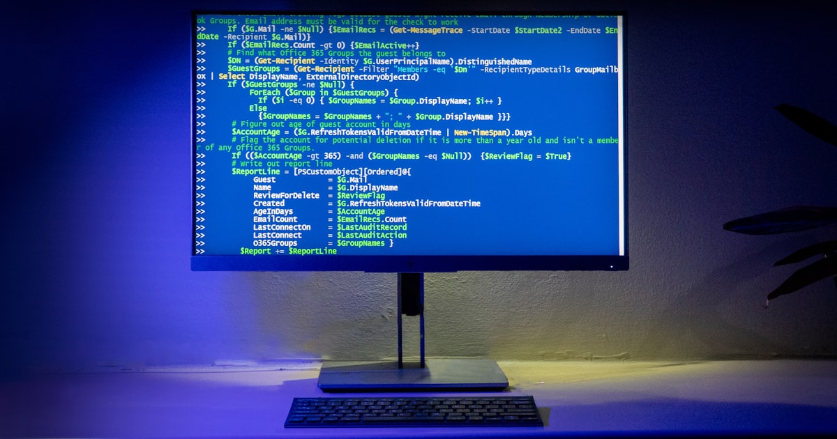 A computer screen displays code on a desktop.