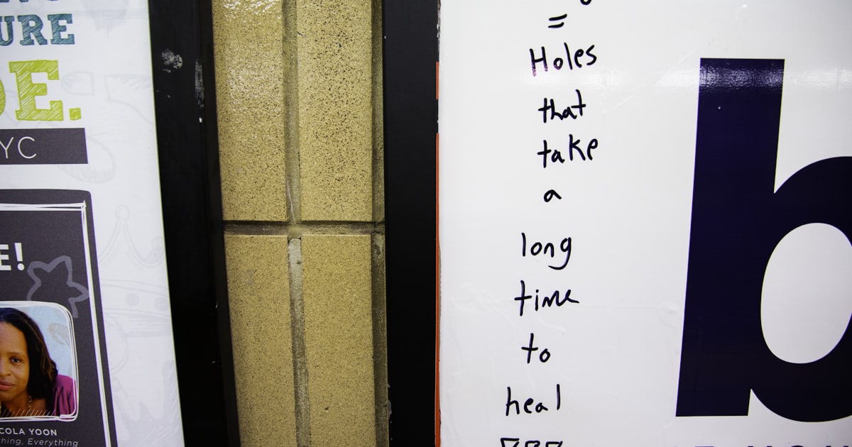 Handwritten anti-drug message on a white poster with other signs.