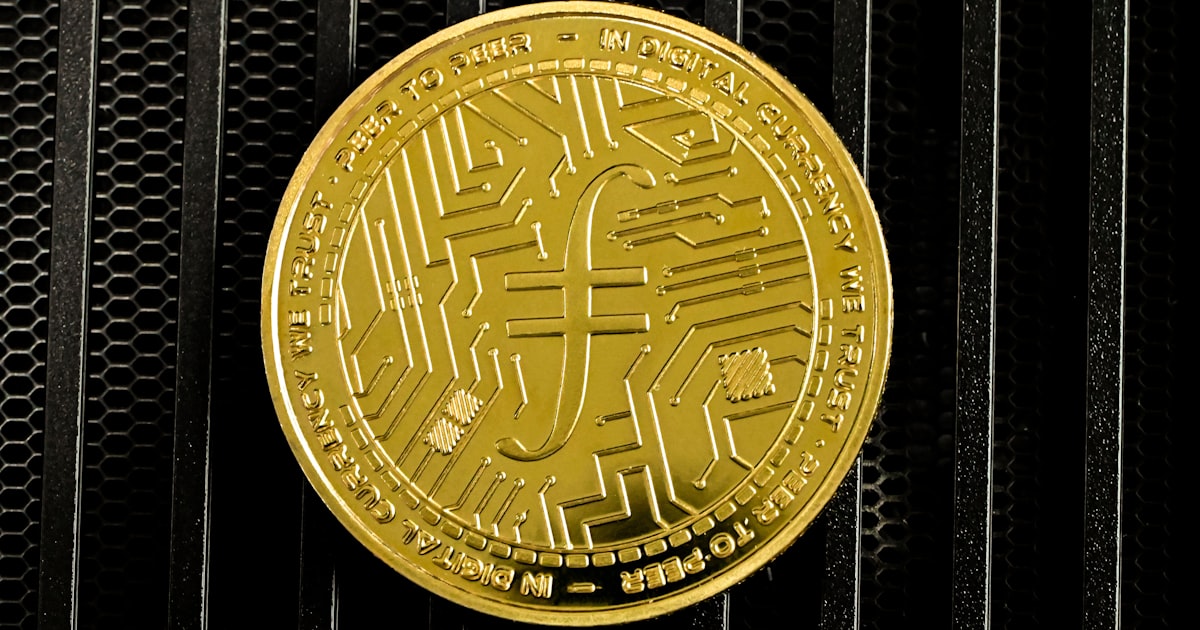 a close up of a gold coin on a black background