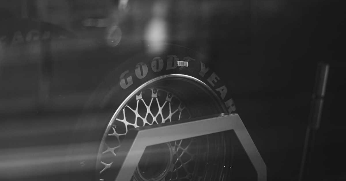 a black and white photo of a tire