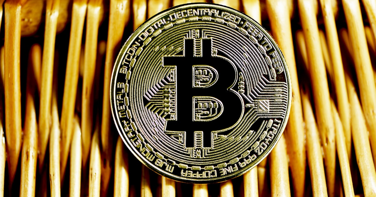 gold and black round logo