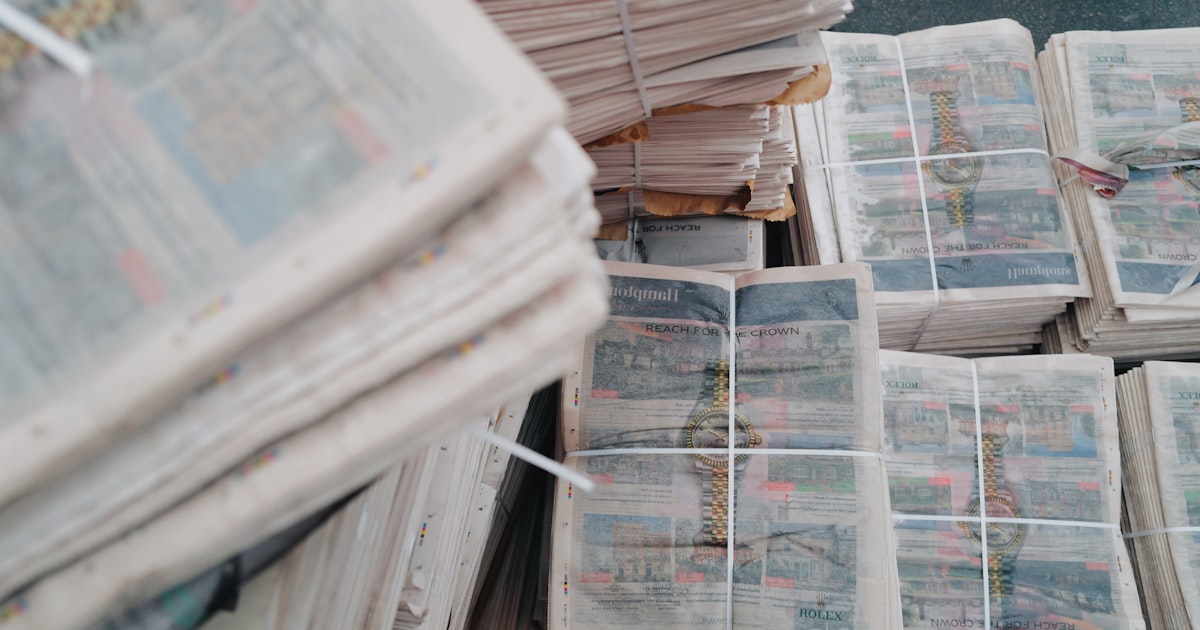 Stacks of newspapers tied with string
