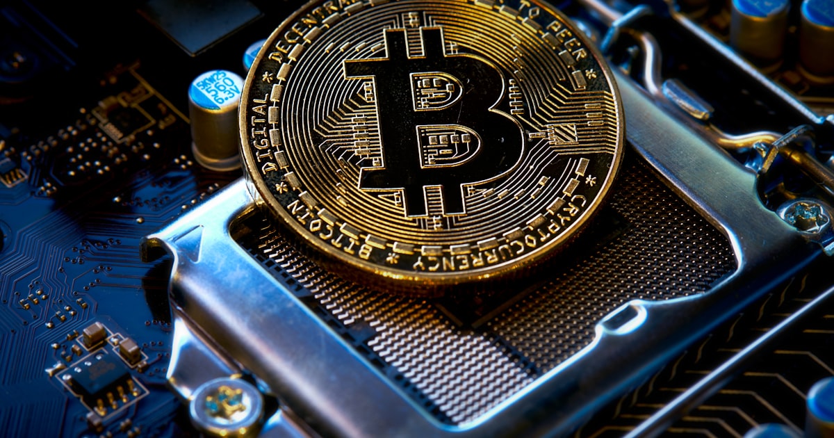 a bitcoin sitting on top of a motherboard