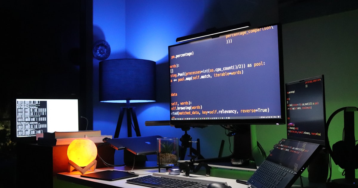 black flat screen computer monitor on green desk