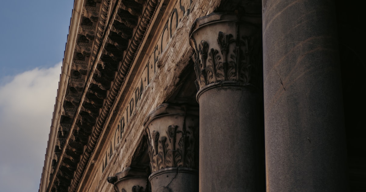 Classical columns and architectural details against sky