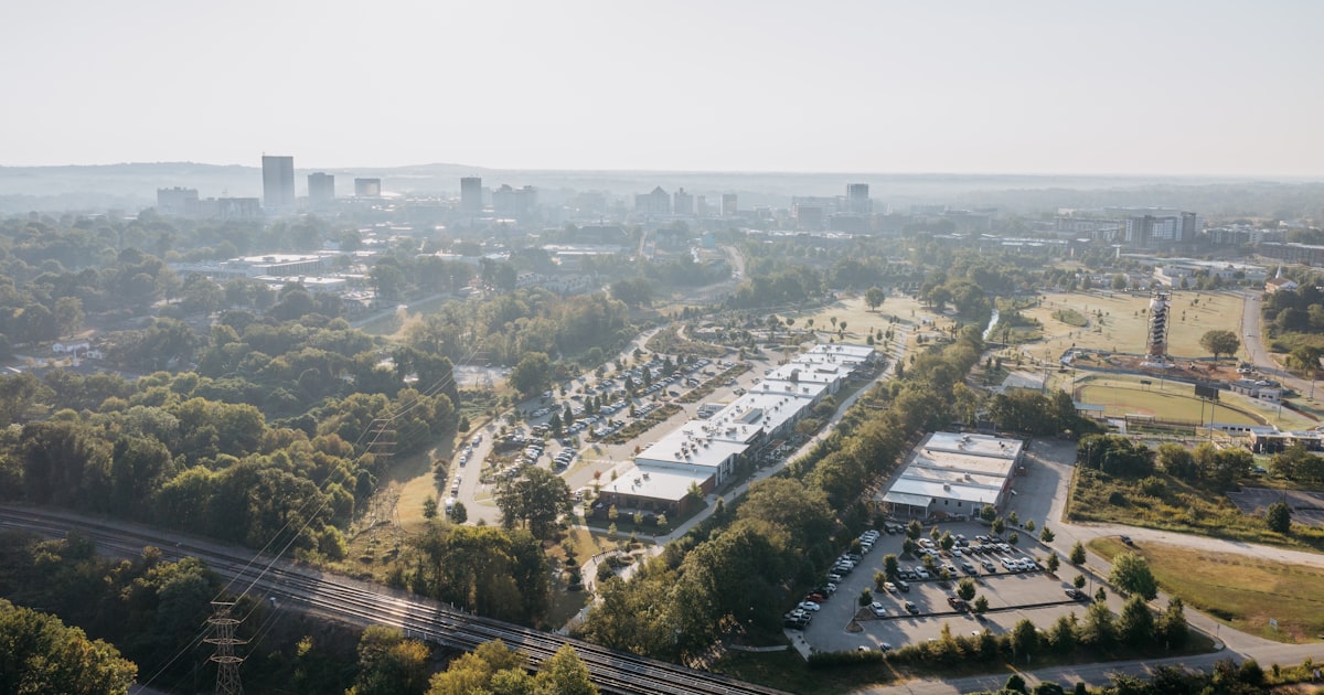 Aerial view of a suburban area with buildings and trees.