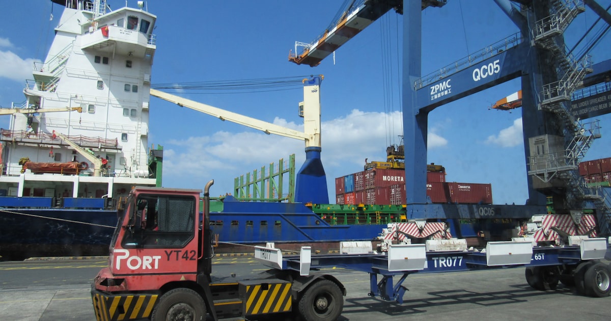 A port with a ship and cargo crane.