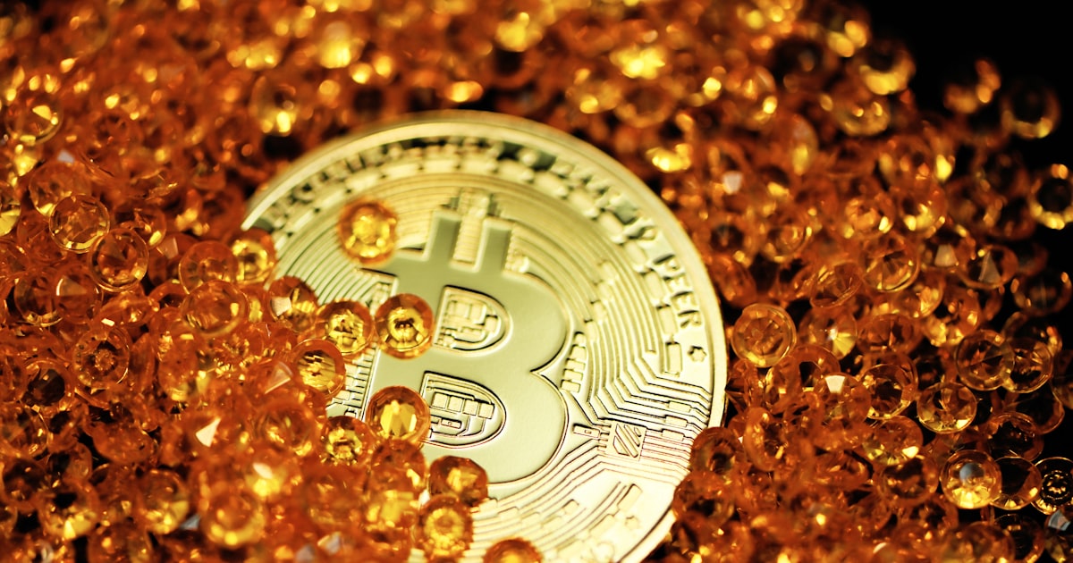 gold round coin on brown and black marble surface