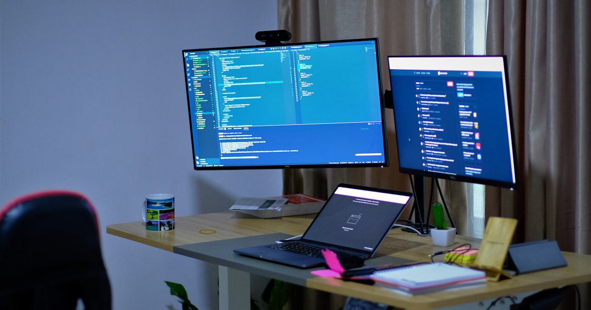 black flat screen tv turned on on white table