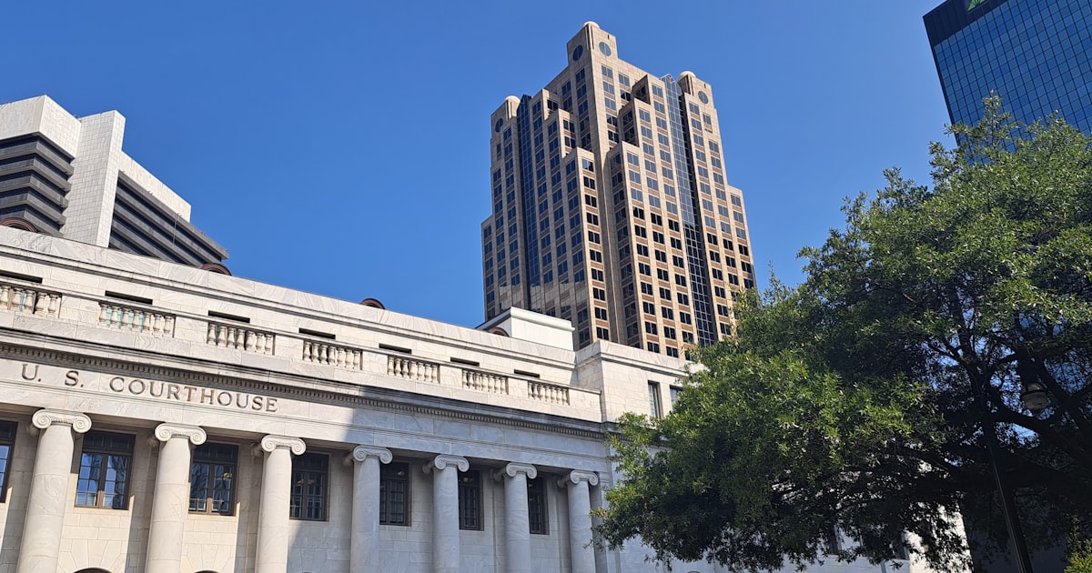 a tall building with a clock on the front of it