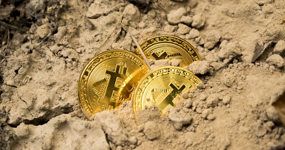 three Bitcoins on soil