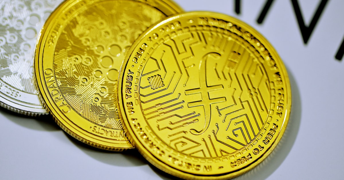 a close up of three gold and silver coins